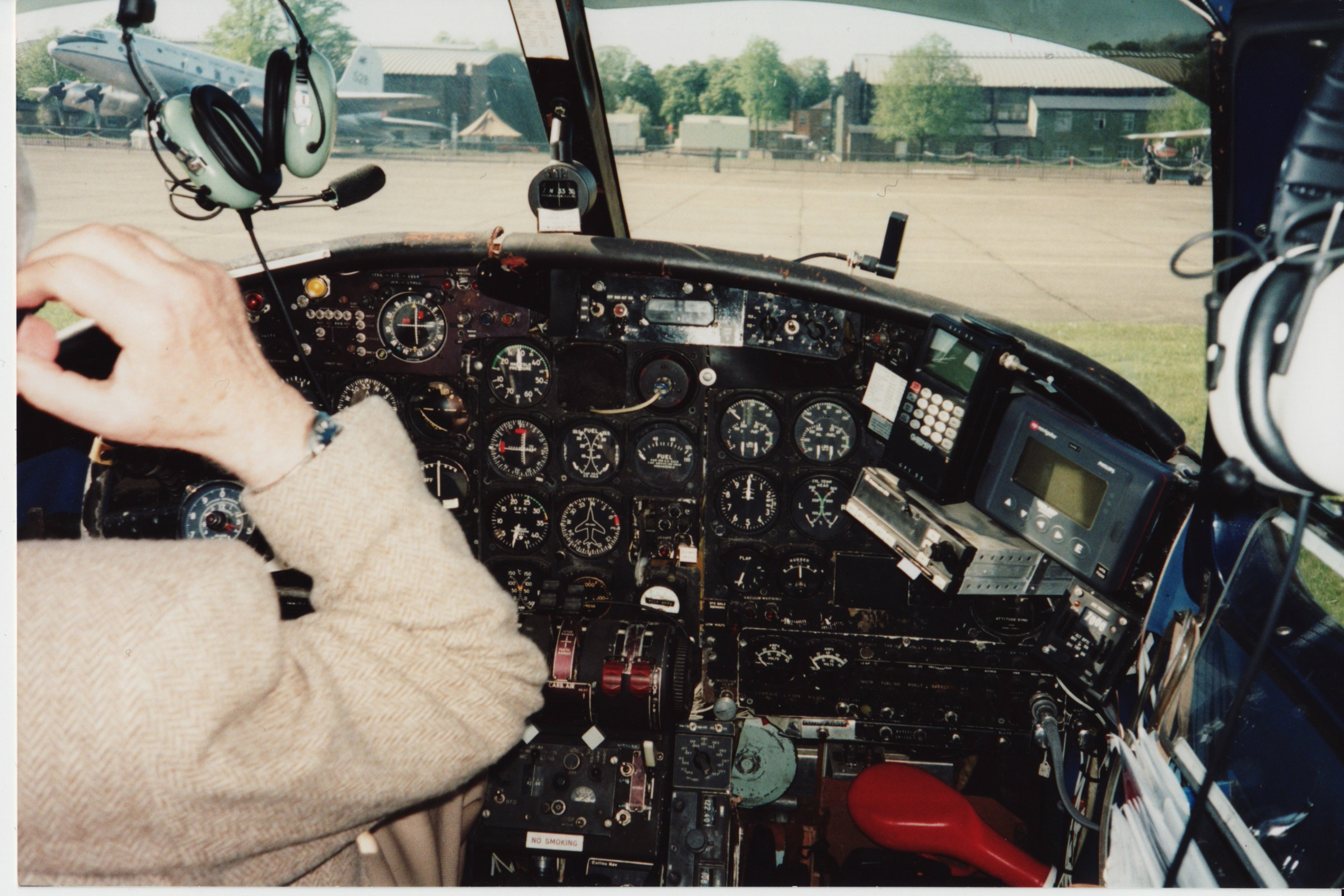 An old photo of the Royal Air Squadron member inside aircraft cockpit